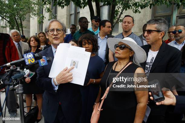 Attorney Robert C. Gottlieb, Alfre Woodward and Maria Velazquez the mother of Jon Adrian Velazquez and Jason Flom speak during a press conference for...