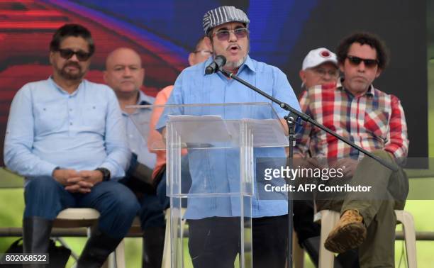 Rebel leader Rodrigo Londono Echeverri, known as "Timochenko" , delivers a speech during the final act of abandonment of arms and the FARC's end as...