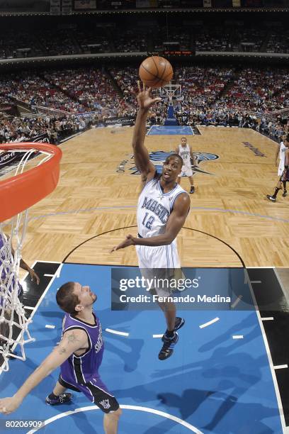 Dwight Howard of the Orlando Magic goes up for the shot during the NBA game against the Sacramento Kings at Amway Arena on February 24, 2008 in...