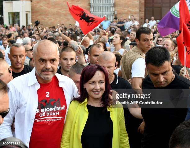 Albania's Prime Minister Edi Rama and wife Linda Basha arrive before a victory rally on June 27, 2017 in Tirana, following June 25 general elections,...