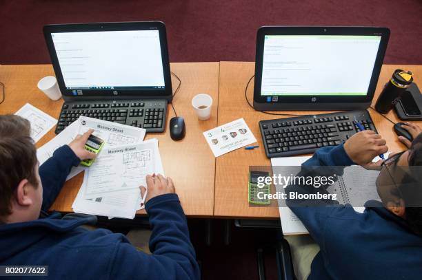 Trainees take a test during Lumber Camp at the 84 Lumber Co. Headquarters in Eighty Four, Pennsylvania, U.S., on Wednesday, June 7, 2017. One of the...