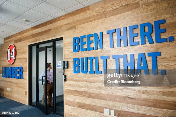 An employee stands in a doorway at the 84 Lumber Co. Headquarters in Eighty Four, Pennsylvania, U.S., on Thursday, June 8, 2017. One of the nation's...