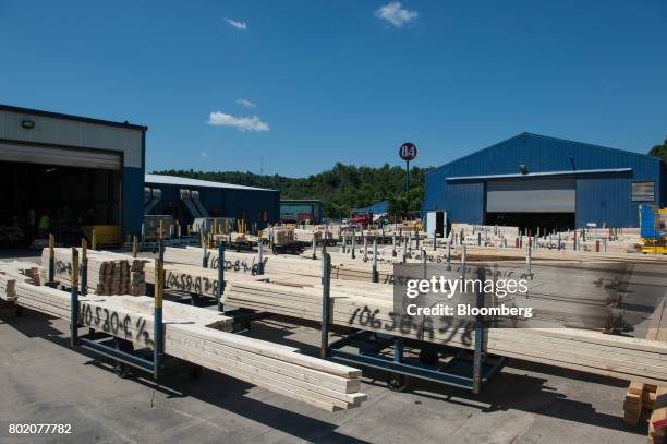 Stacks of wood boards sit outside the 84 Lumber Co. California Truss Plant in Coal Center, Pennsylvania, U.S., on Friday, June 9, 2017. One of the...