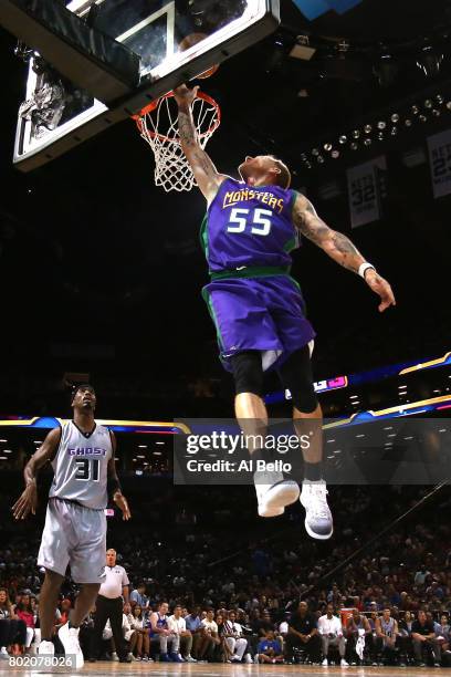 Jason Williams of the 3 Headed Monsters drives to the basket against Ricky Davis of the Ghost Ballers during week one of the BIG3 three on three...