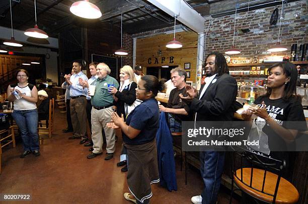 Supporters of Democratic presidential hopeful Sen. Barack Obama watch the Mississippi primary results at a coffee house March 11, 2008 in Meridian,...