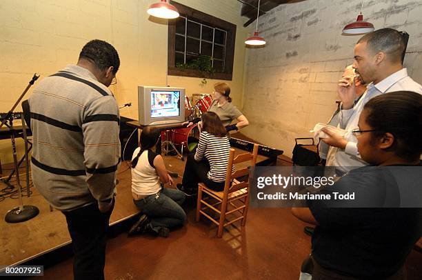 Supporters of Democratic presidential hopeful Sen. Barack Obama watch the Mississippi primary results March 11, 2008 in Meridian, Mississippi. The...