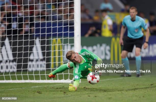 Jannik Pollersbeck of Germany saves England fifth penalty taken by Nathan Redmond of England to win the penalty shoot out during the UEFA European...