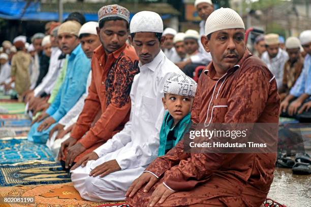 Muslim devotees offer prayers on the occasion of Eid-ul-fitr at Antop hill on June 26, 2017 in Mumbai, India.