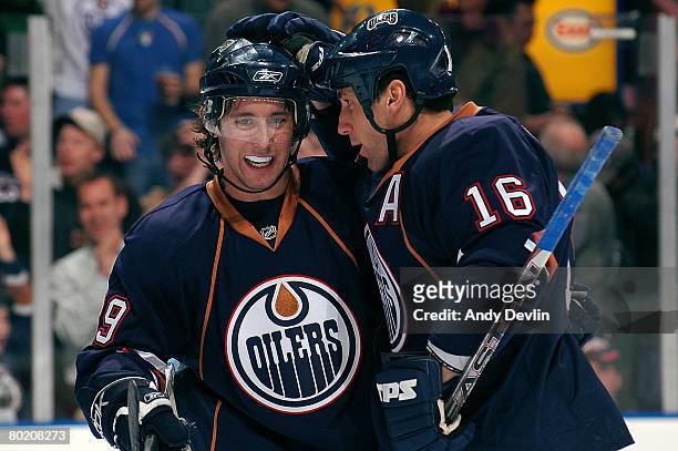 Sam Gagner and Jarret Stoll of the Edmonton Oilers celebrate one of three first period goals against the St. Louis Blues at Rexall Place on March 11,...
