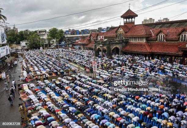 Muslims offer Eid al-Fitr prayers at outside Bandra station on June 26, 2017 in Mumbai, India. Eid al-Fitr marks the end of the Muslims' holy fasting...