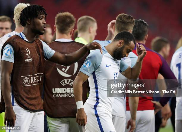 Nathaniel Chalobah of England consoles Nathan Redmond of England after he missed England's fifth penatly and sent them out of the tournament during...