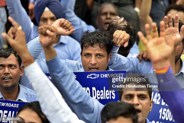 General Motors India’s dealers, members of Federation of Automobiles dealers Associations along with their employees protest against Chevrolet after...