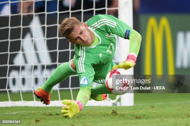 Jannik Pollersbeck of Germany saves England fifth penalty taken by Nathan Redmond of England to win the penalty shoot out during the UEFA European...