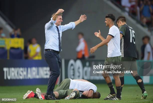 Stefan Kuntz, coach of Germany celebrates winning a penalty shoot out with Mahmoud Dahoud of Germany during the UEFA European Under-21 Championship...