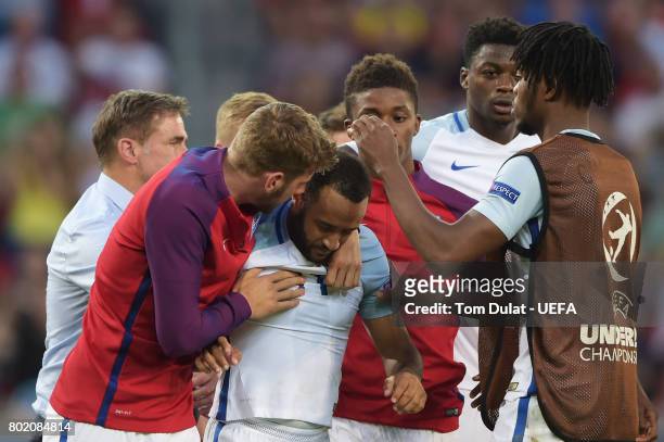Jack Stephens of England consoles Nathan Redmond of England after he missed England's fifth penatly and sent them out of the tournament during the...