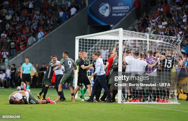 Stefan Kuntz, coach of Germany and his Germany team celebrate winning the penatly shoot out after the UEFA European Under-21 Championship Semi Final...