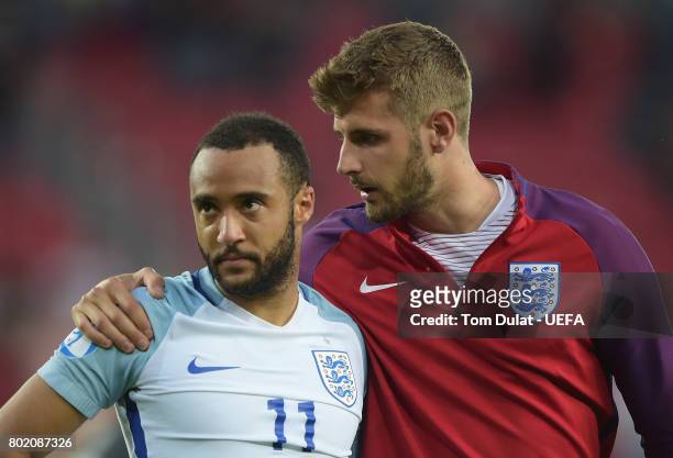 Jack Stephens of England consoles Nathan Redmond of England after he missed England's fifth penatly and sent them out of the tournament during the...