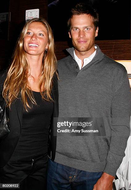 Model Gisele Bundchen and New England Patriots quarterback Tom Brady attend the opening of Ermenegildo Zegna Global Store on 5th Avenue on March 11,...