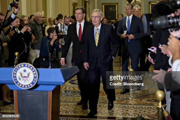 Senate Majority Leader Mitch McConnell, a Republican from Kentucky, center, arrives to a news conference after a GOP luncheon meeting at the U.S....