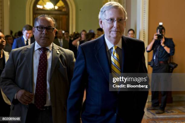 Senate Majority Leader Mitch McConnell, a Republican from Kentucky, walks to his office after a GOP luncheon meeting at the U.S. Capitol in...