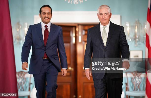Secretary of State Rex Tillerson escorts Qatari Foreign Minister Sheikh Mohammed Bin Abdulrahman Al Thani prior to a scheduled meeting at the State...