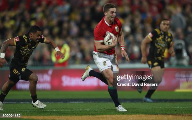 George North of the Lions breaks to score a try during the match between the Hurricanes and the British & Irish Lions at Westpac Stadium on June 27,...