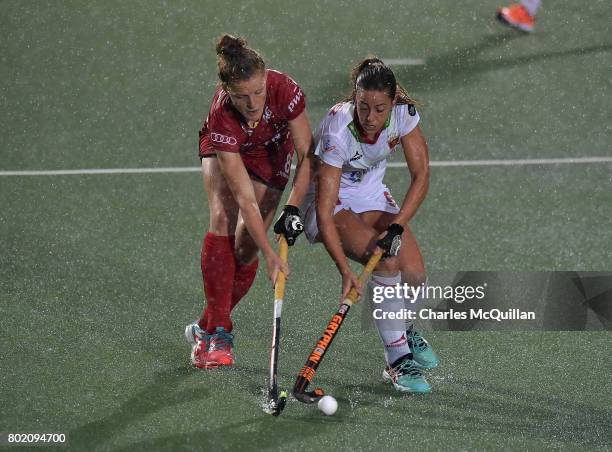 Emma Puvrez of Belgium and Maria Lopez of Spain during the FINTRO Women's Hockey World League Semi-Final Pool B game between Belgium and Spain on...