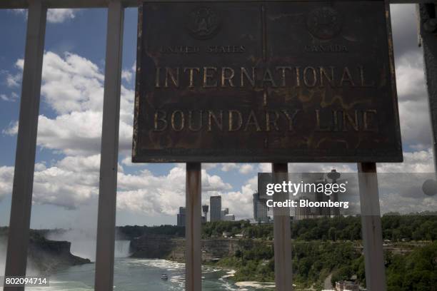 Sign marks the international boundary line between the U.S. And Canada in Niagara Falls, Ontario, Canada, on Wednesday, June 21, 2017. The 150th...