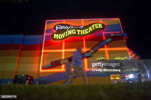 Pedestrians walk past Ripley's Moving Theater in Niagara Falls, Ontario, Canada, on Wednesday, June 21, 2017. The 150th anniversary of Canada,...