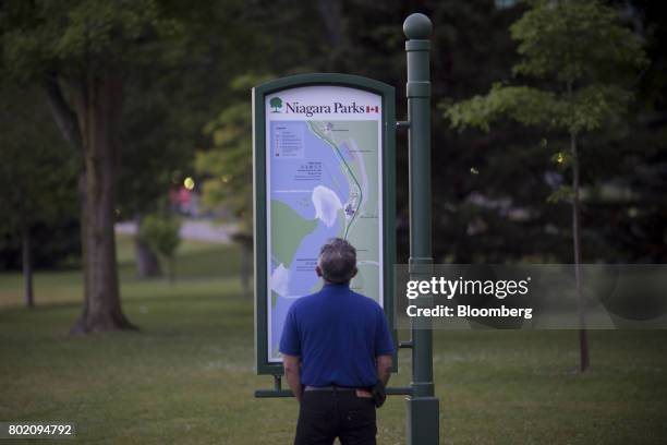 Tourist reads a map in Niagara Falls, Ontario, Canada, on Wednesday, June 21, 2017. The 150th anniversary of Canada, promoted as Canada 150, marks...