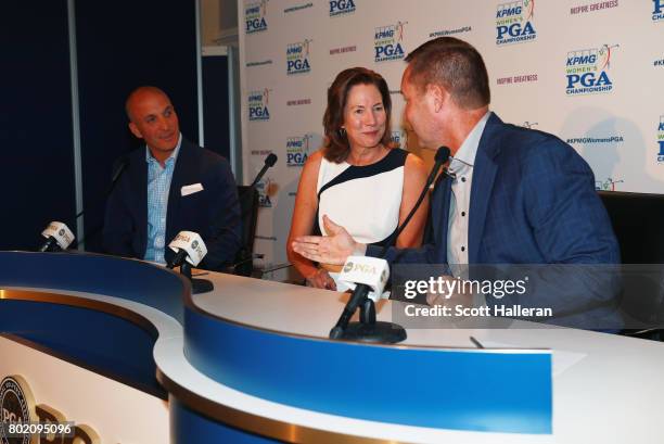 Pete Bevacqua, CEO of the Pga of America, Lynne Doughtie, Chairman and CEO of KPMG and LPGA Commissioner Mike Whan are seen on stage after an...