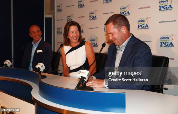 Pete Bevacqua, CEO of the Pga of America, Lynne Doughtie, Chairman and CEO of KPMG and LPGA Commissioner Mike Whan are seen on stage after an...