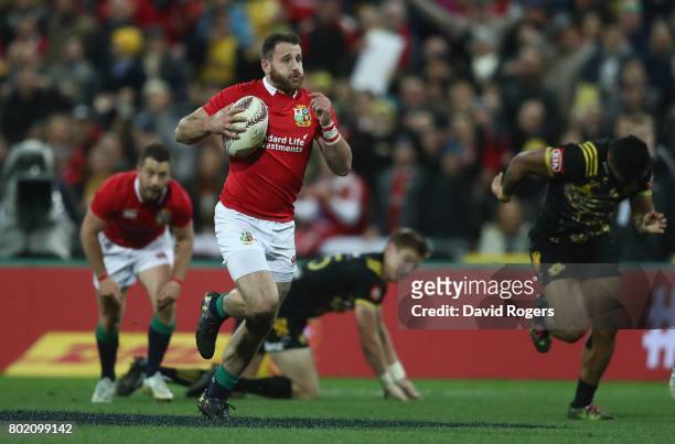 Tommy Seymour of the Lions breaks to score his first try during the match between the Hurricanes and the British & Irish Lions at Westpac Stadium on...