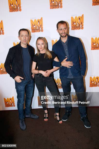Voices of the movie, Audrey Lamy standing between Gad Elmaleh and his brother Arie Elmaleh attend the Despicable Me Paris Premiere at Cinema Gaumont...