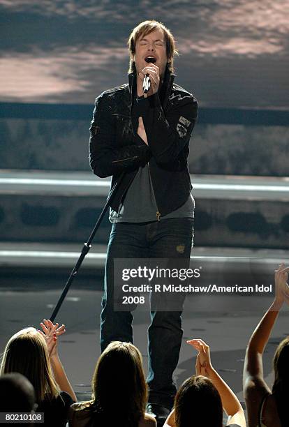 Contestant David Cook performs "Eleanor Rigby" by The Beatles live on American Idol March 11, 2008 in Los Angeles, California. The top 12 contestants...