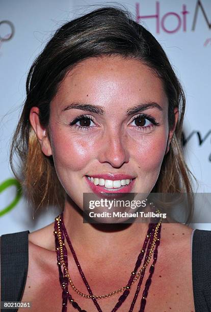 Anya Assante poses on the red carpet at the Hot Moms Club 'Super Community' launch party and fundraiser, held at the Stone Rose Lounge on March 11,...