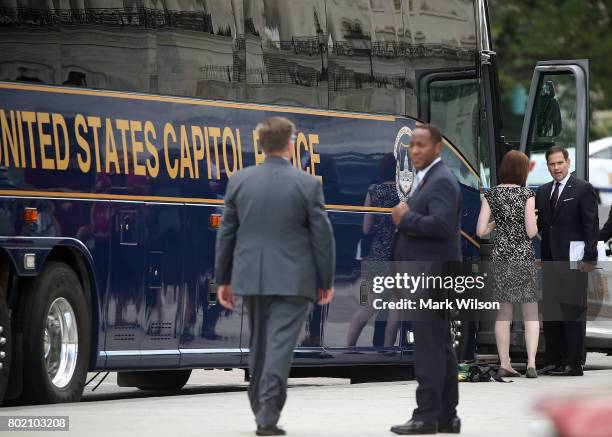 Sen. Marco Rubio , boards a bus to be driven to a meeting with President Donald Trump at the White House on Capitol Hill, June 27, 2017 in...