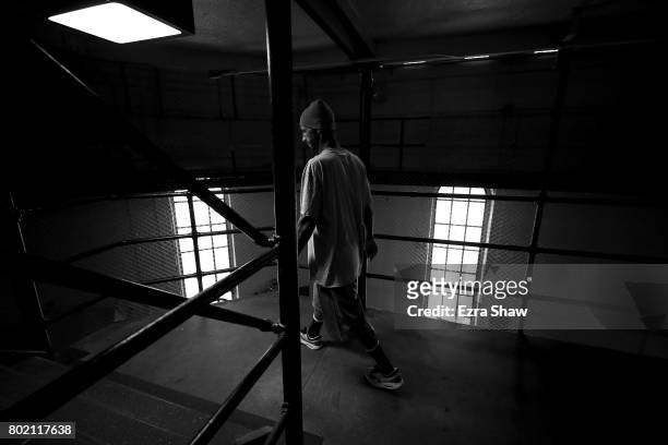 Branden Terrel walks up the stairs to his cell on June 8, 2017 in San Quentin, California. Branden Terrel was sentenced to 11 years in state prison...