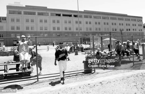 Branden Terrel walks through the yard on his way to returning to their baseball game against the Sonoma Stompers on May 27, 2017 in San Quentin,...