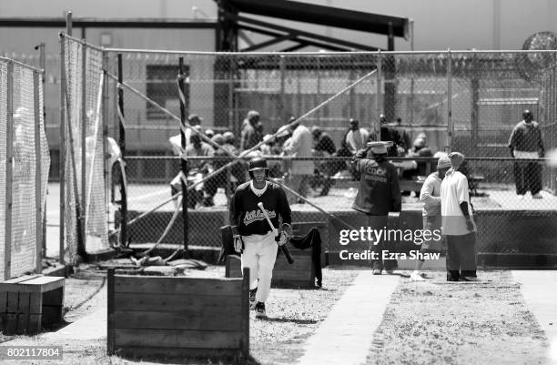 Branden Terrel walks through the yard on his way to returning to their baseball game against the Sonoma Stompers on May 27, 2017 in San Quentin,...