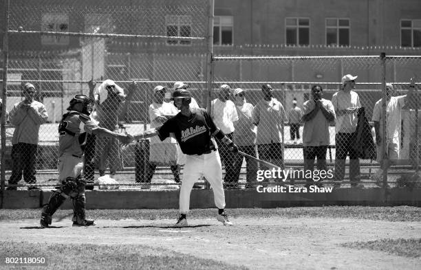 Branden Terrel shakes hands with the catcher from Club Mexico before an at bat on April 29, 2017 in San Quentin, California. Branden Terrel was...