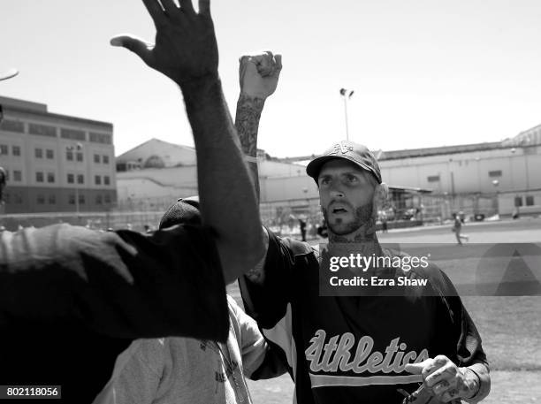 Branden Terrel is congratulated by a teammate as he comes off the field during their game against Club Mexico on April 29, 2017 in San Quentin,...