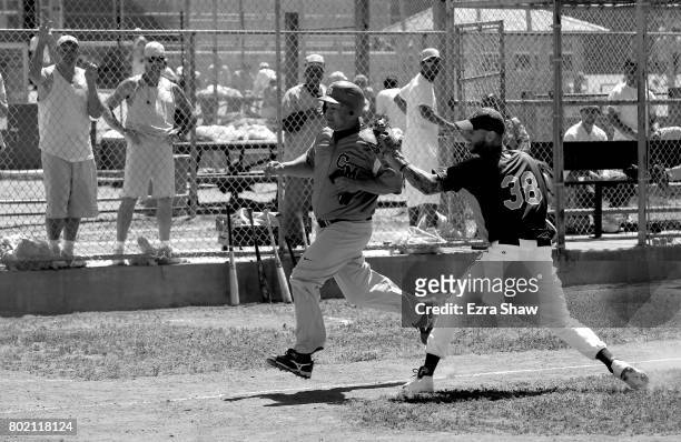 Branden Terrel tags out a runner from Club Mexico on April 29, 2017 in San Quentin, California. Branden Terrel was sentenced to 11 years in state...