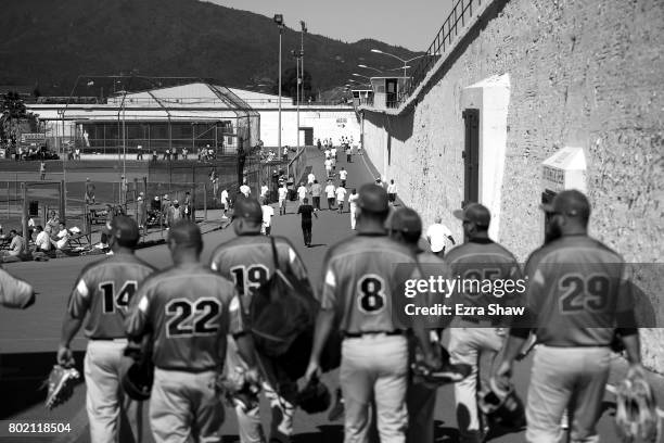 Club Mexico baseball team from Stockton, California, walks to the yard to play the San Quentin Athletics on April 29, 2017 in San Quentin,...