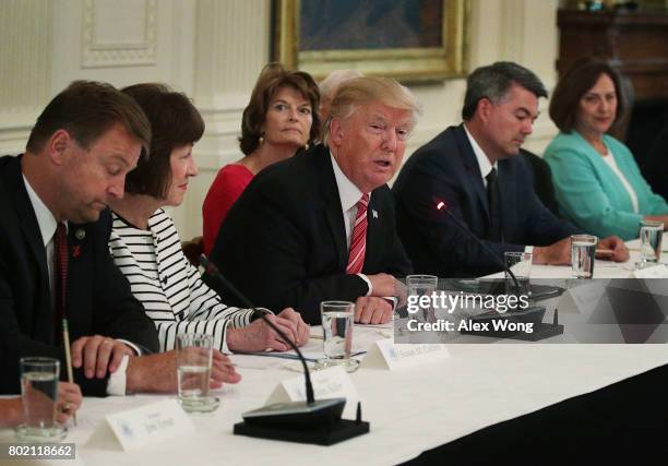 President Donald Trump speaks as Sen. Dean Heller , Sen. Susan Collins , Sen. Lisa Murkowski , Sen. Cory Gardner and Sen. Deb Fischer listen during a...