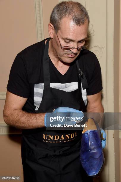 Undandy shoe cobblers handcrafting shoes at the launch of the Undandy coffee table book on June 27, 2017 in London, United Kingdom.