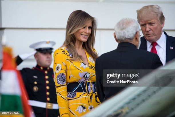 President Donald Trump and First Lady Melania Trump, bid goodbye to Prime Minister Narendra Modi of India, as he left the South Portico of the White...