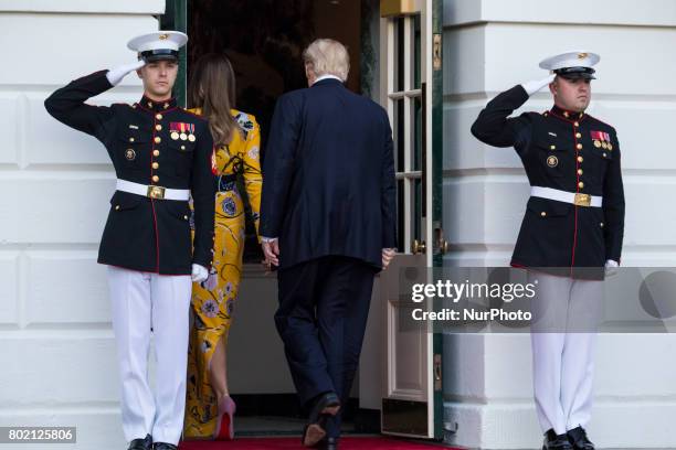 First Lady Melania Trump, and President Donald Trump head back in to the White House, after the departure of Prime Minister Narendra Modi of India,...