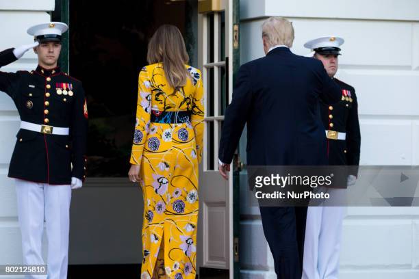 First Lady Melania Trump, and President Donald Trump head back in to the White House, after the departure of Prime Minister Narendra Modi of India,...