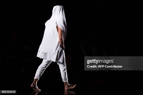 Model presents a creation by Amoramargo, designed by Spanish Flamenco's dancer Rafael Amargo during the 080 Barcelona Fashion Week, at Sant Pau...